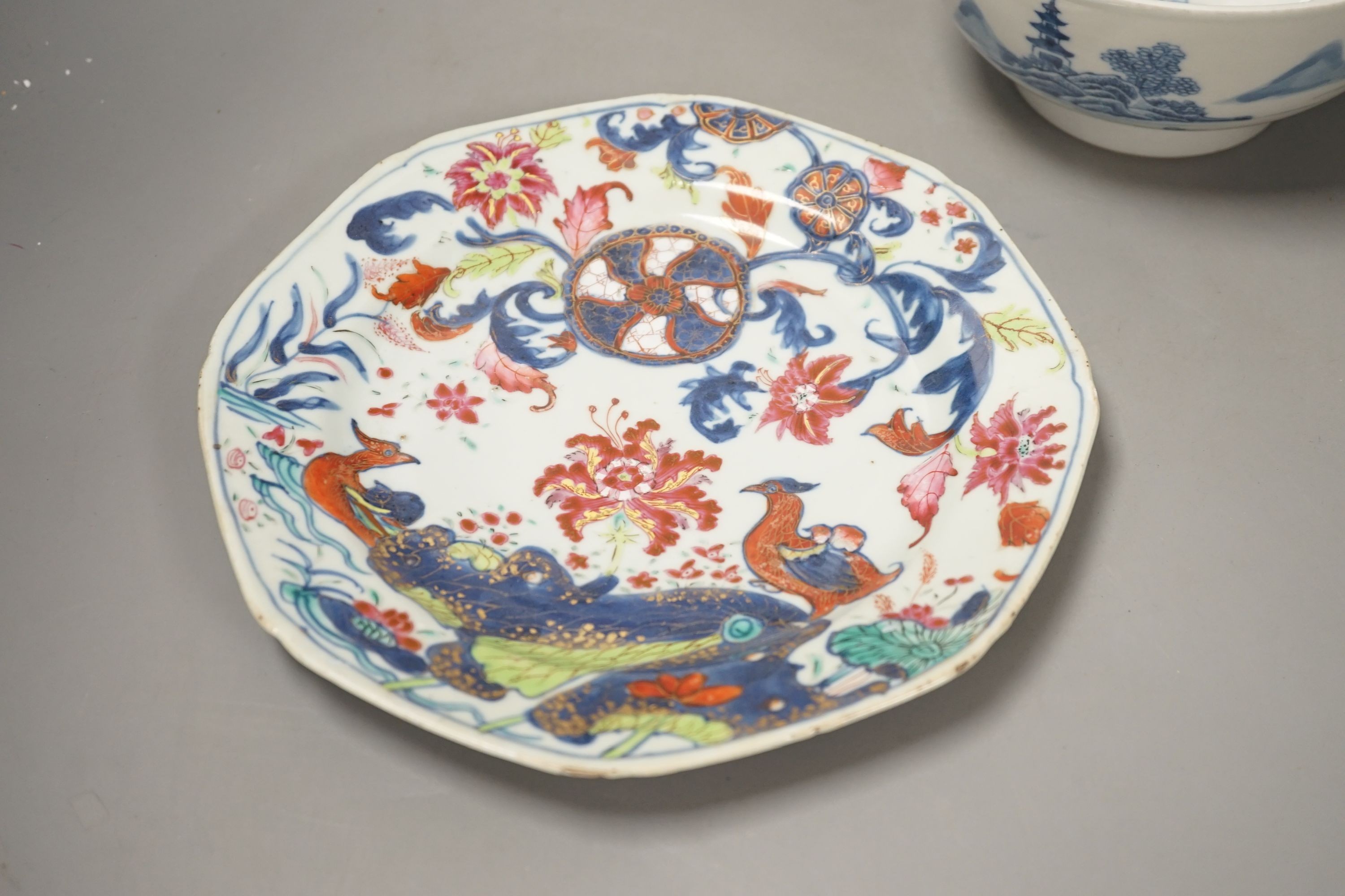 An 18th century Chinese famille rose ‘birds and lotus’ plate, and a Chinese blue and white ‘landscape’ bowl, 17.6cm
